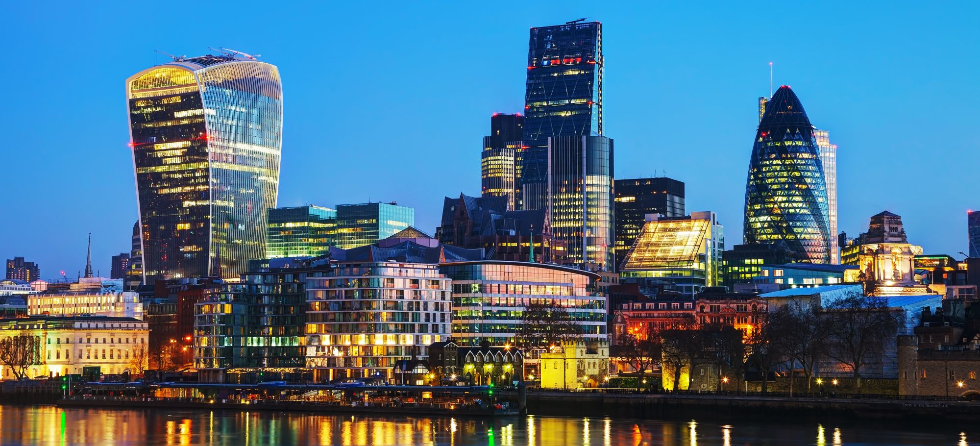 The City of London at dusk seen across the Thames